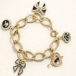 Gold Tone Charm Bracelet with Bows!